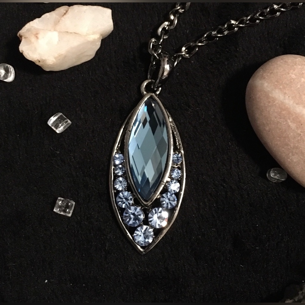 Dark Metal Necklace With Marquise Shaped Pendant And Blue Gem Detail